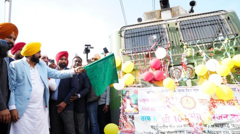 CM Bhagwant Mann flagged off train for pilgrims going to Banaras CM Bhagwant Mann flagged off train for pilgrims going to Banaras