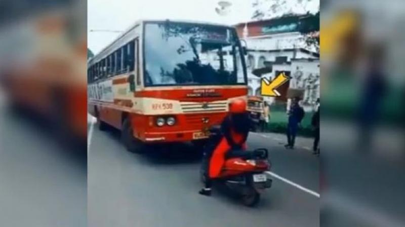 kerala woman on scooty makes bus driver take right lane viral video