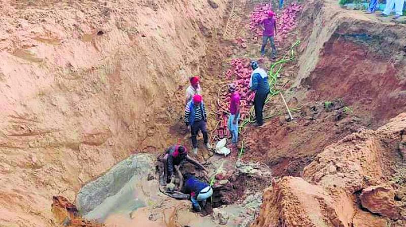Two workers died due to landslide while making man hole Two workers died due to landslide while making man hole