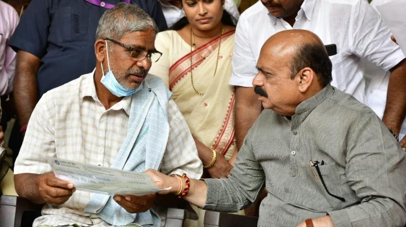 Karnataka CM hands over cheque of Rs 25 lakh to family of student killed in Ukraine Karnataka CM hands over cheque of Rs 25 lakh to family of student killed in Ukraine