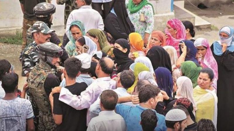 Jammu kashmir long queues outside phone booths people trying to connect