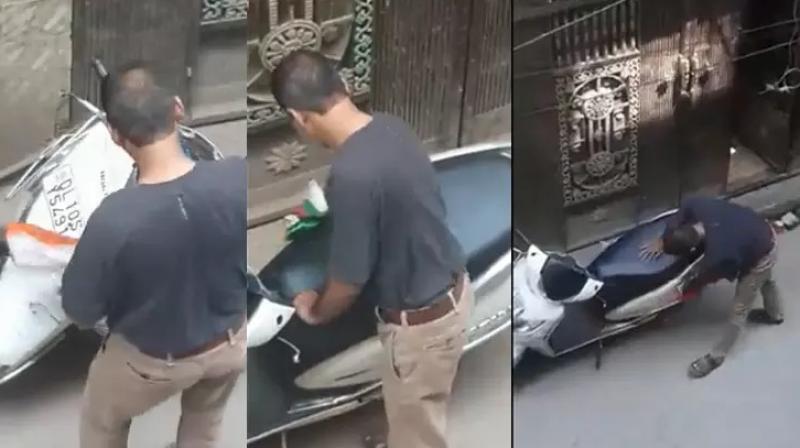 Man Uses Tricolour to Clean His Scooty, Arrested by Delhi Police Man Uses Tricolour to Clean His Scooty, Arrested by Delhi Police