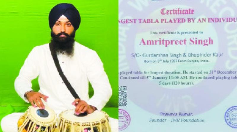 Sikh youth made a record by playing tabla for 120 hours continuously Sikh youth made a record by playing tabla for 120 hours continuously