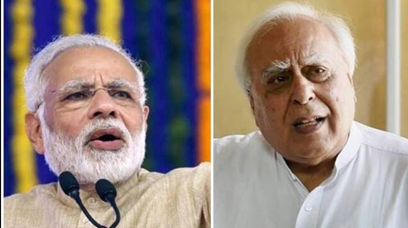 PM Modi and Kapil Sibal 