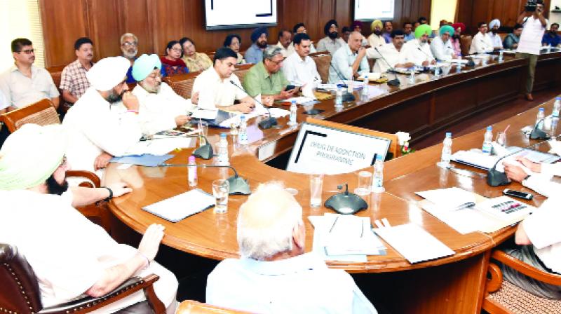 Captain Amarinder Singh discussing with ministers and officials Captain Amarinder Singh discussing with ministers and officials