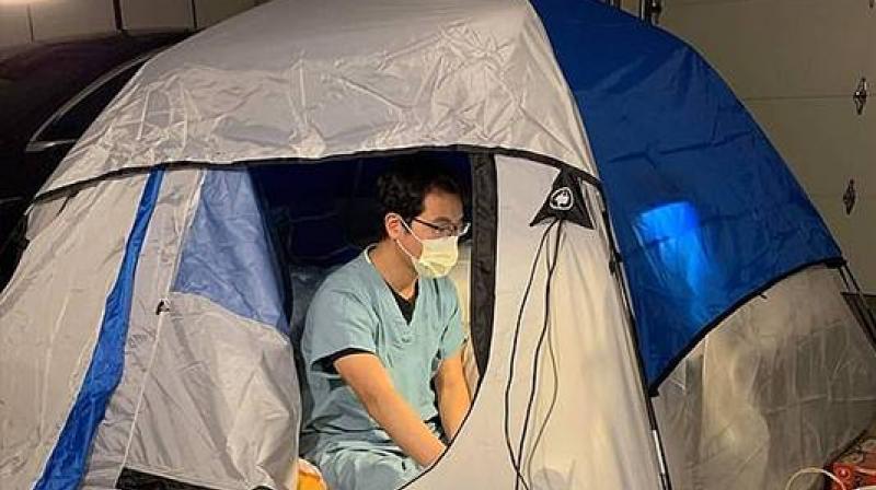 Doctor lives tent garage protect wife children coronavirus Doctor lives tent garage protect wife children coronavirus
