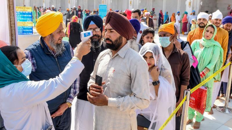 Wearing a mask is a must for sangats visiting Darbar Sahib Wearing a mask is a must for sangats visiting Darbar Sahib