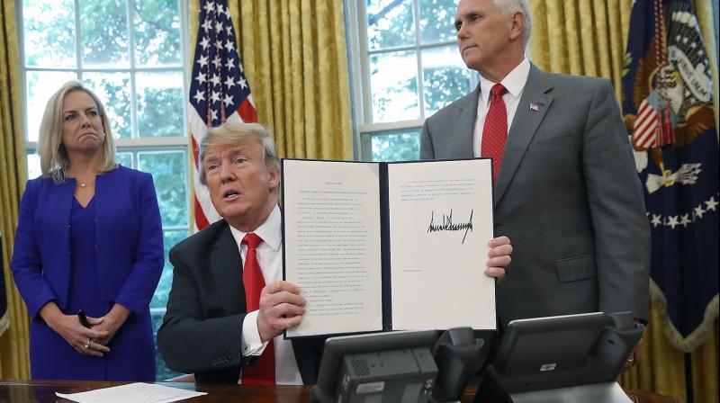 Trump signs executive order to end migrant family separation at border Trump signs executive order to end migrant family separation at border