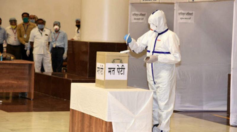 Corona Positive MLA casts vote using PPE kit Corona Positive MLA casts vote using PPE kit