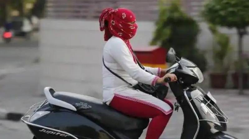 Women are not wearing helmets in Chandigarh Women are not wearing helmets in Chandigarh