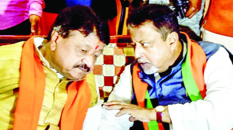 BJP national general secretary Kailash Vijayvargiya and party leader Mukul Roy discussions after the High Court verdict.