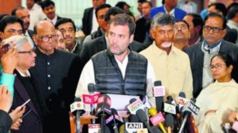 Congress President Rahul Gandhi addressing the media after the meeting of the opposition in Delhi. Leaders of different parties are also seen in the picture.