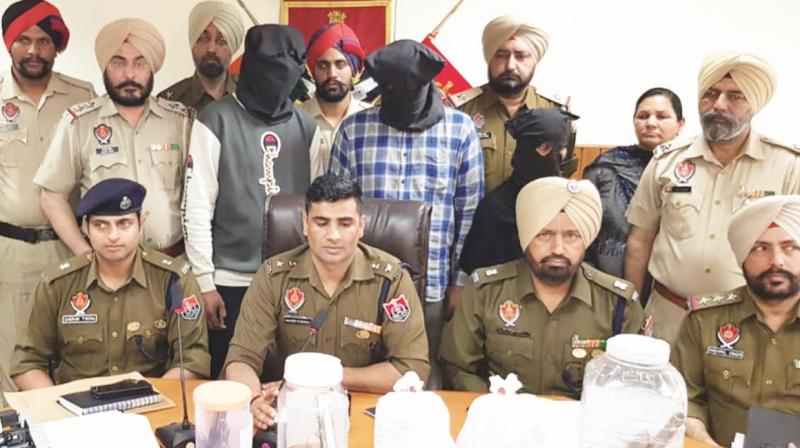 Two crores heroin, cash and arms seized Two crores heroin, cash and arms seized