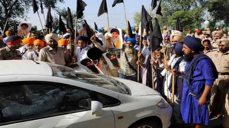 Sikhs protest against Badals - File Photo
