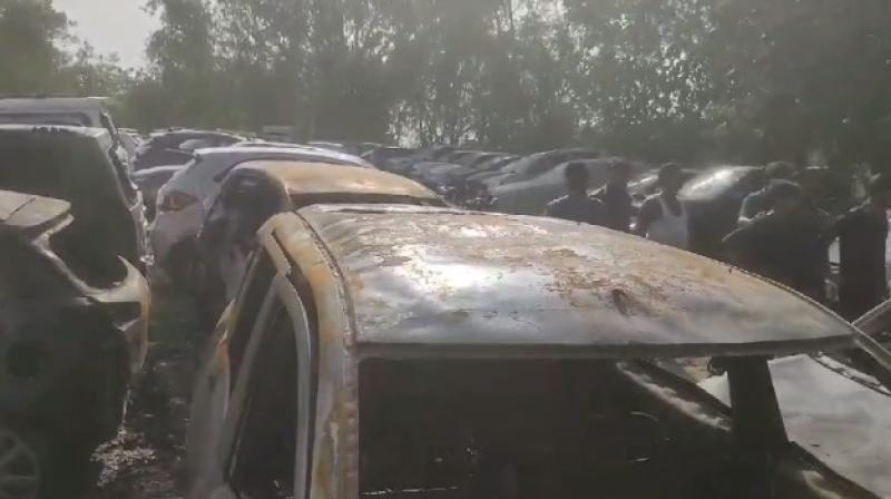 Fire engulfs 19 vehicles in Delhi's Madhu Vihar parking lot Fire engulfs 19 vehicles in Delhi's Madhu Vihar parking lot
