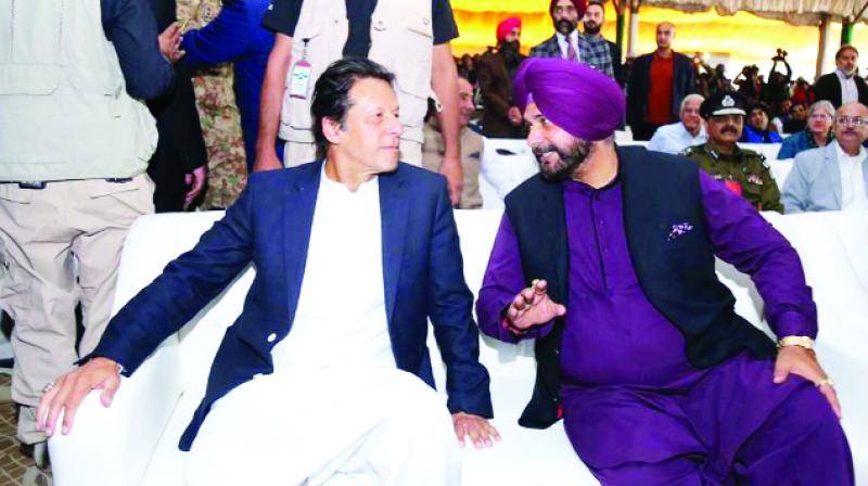 Imran Khan and Navjot Singh Sidhu talking during the ceremony