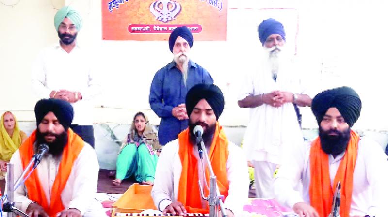 Singh performing Kirtan on the occasion.