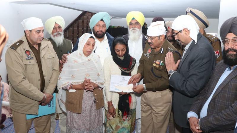  A check of Rs 2 crore handed over to the family of Shaheed Constable Mandeep Singh