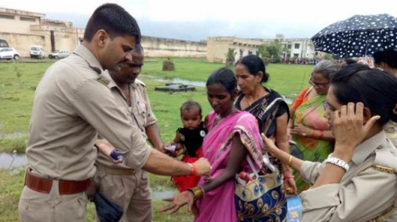 Muslim lady ties Rakhi Muslim lady ties Rakhi