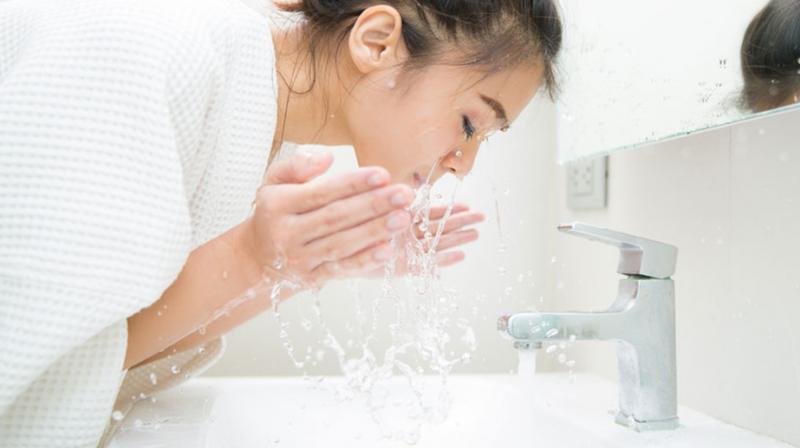 wash face with water