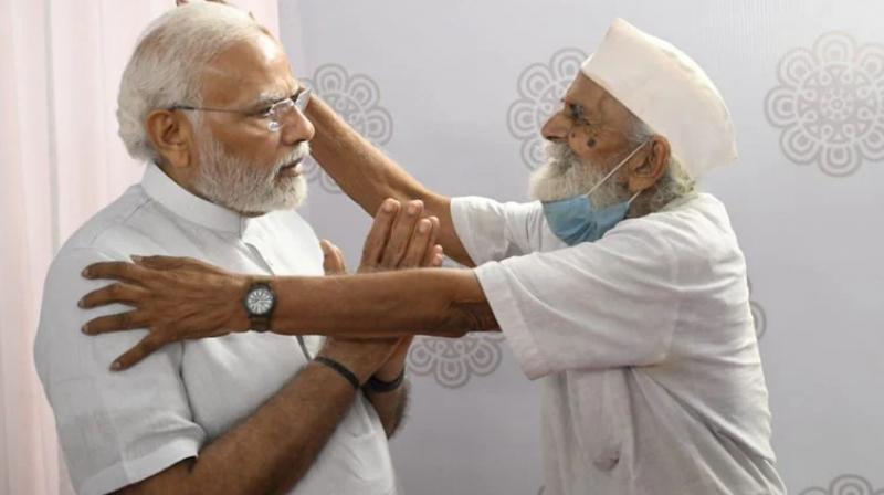 PM Modi meets his former school teacher in Gujarat's Navsari PM Modi meets his former school teacher in Gujarat's Navsari