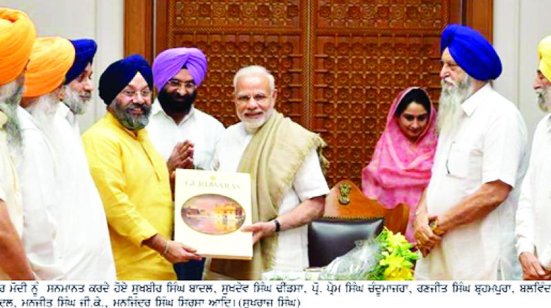 Honoring Prime Minister Narendra Modi, Sukhbir Singh Badal, Harsimrat Kaur Badal, and others.