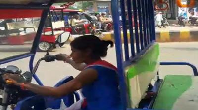 Anjali driving E-Rickshaw