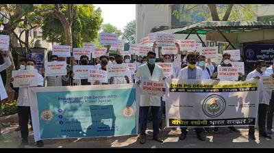 Students who have completed DNB Medical PG Degree Course protest in front of Dwarka office
