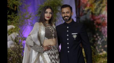 Sonamkapoor and anandahuja at wedding reception