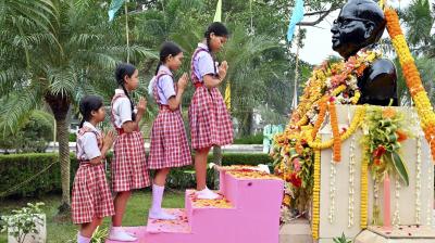 Agartala: Schoolgirls pay tribute to BR Ambedkar on his death anniversary, in Agartala, Wednesday, Dec. 6, 2023. (PTI Photo) 