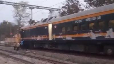 Railway Workers Push Train Coach 
