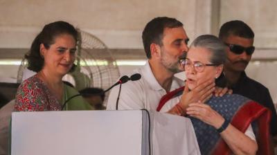 Rae Bareli: Congress leader and party candidate from Rae Bareli constituency Rahul Gandhi greets his mother and party leader Sonia Gandhi during a public meeting for the Lok Sabha elections, in Rae Bareli district, Friday, May 17, 2024. Congress leader Priyanka Gandhi is also seen. (PTI Photo)