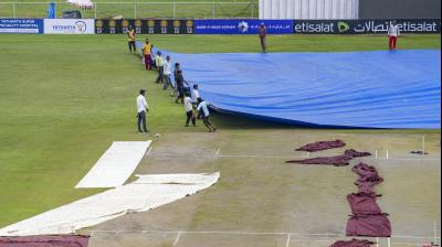 Greater Noida: Groundsmen remove the cover of the pitch before the start of second day of a one-off Test match between Afghanistan and New Zealand, in Greater Noida, Tuesday, Sept 10, 2024. The first day of the test was washed out. (PTI Photo/Kamal Kishore)