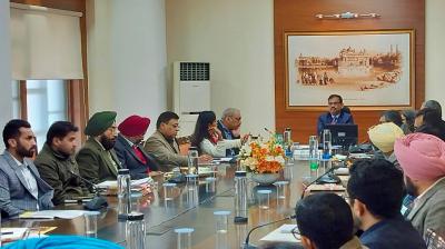 Chief Secretary in meeting.