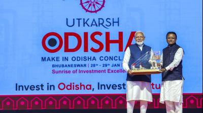 Prime Minister Narendra Modi with Odisha Chief Minister Mohan Charan Majhi during the 'Utkarsh Odisha' - Make in Odisha Conclave, in Bhubaneswar. (PMO via PTI Photo)