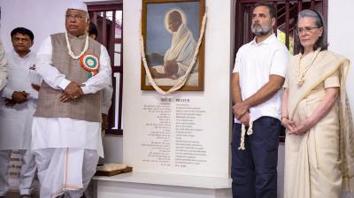 Congress President Mallikarjun Kharge with LoP in the Lok Sabha and party leader Rahul Gandhi, and party leader Sonia Gandhi during a prayer meet at the Sabarmati Ashram, in Ahmedabad. (AICC via PTI Photo)