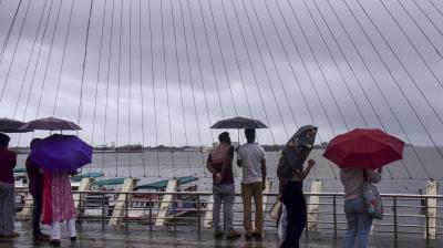 Kochi: Visitors at the Rainbow Bridge amid rainfall, in Kochi, Kerala, Saturday, June 14, 2025. (PTI Photo)