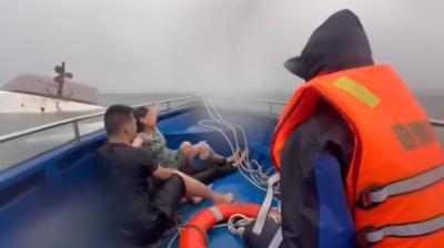 Boat capsizes in Vietnam due to storm.
