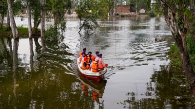 Amritsar: Officials inspect a flood-affected area in a boat, at Ajnala in Amritsar district, Punjab, Saturday, Sept. 6, 2025. (PTI Photo/Shiva Sharma)