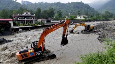 Dehradun: Excavators being used to clear mud and silt following cloudbursts and heavy rains, in Dehradun, Wednesday, Sept. 17, 2025. (PTI Photo)