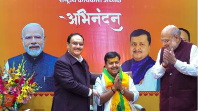 Union Ministers Amit Shah and JP Nadda congratulate newly appointed BJP National Working President Nitin Nabin during a ceremony, in New Delhi. (@AmitShah/X via PTI Photo)