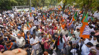 BJP workers stage a protest against Arvind Kejriwal