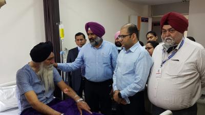 Pargat Singh enquire after the health of International Boxer Kaur Singh