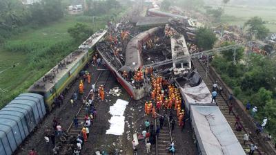Balasore: Locals, security personnel and NDRF  during the search and rescue operation at the site where Coromandel, Bengaluru-Howrah Express trains derailed, in Balasore district, Saturday, June 3, 2023. (PTI Photo)