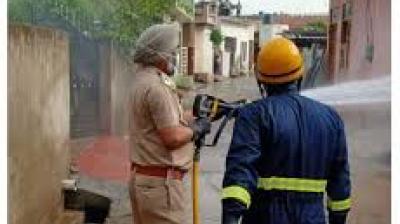 Employee doing sanitization at village Jawaharpur