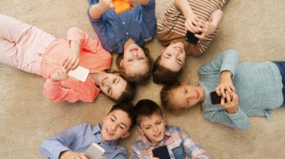 Kids playing with mobiles