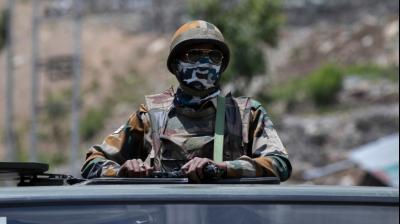  Indian soldiers carry weapons while on duty at the border