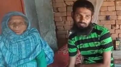 Kudratullah with his mother.