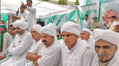 Bharatiya Kisan Union (BKU) leader Naresh Tikait with Khap Panchayat members during a Khap 'Mahapanchayat' organised over the ongoing protest by wrestlers against WFI President Brij Bhushan Sharan Singh, at Soram village, in Muzaffarnagar,