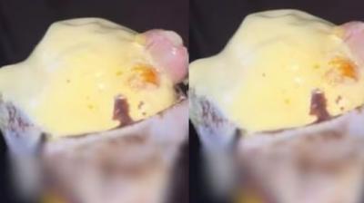 Severed finger sticking out of ice cream cone, person's senses blown